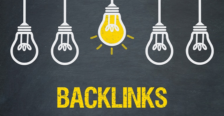 OffPageSEO_1 • Andrew Roche SEO Five hanging light bulbs are drawn on a dark chalkboard background, with the center bulb lit up in yellow to symbolize a bright idea. Below the bulbs, the word "BACKLINKS" is boldly written in yellow capital letters, highlighting the concept's importance in SEO.