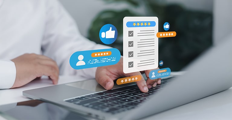 OffPageSEO_8 • Andrew Roche SEO A person types on a laptop keyboard with floating digital review icons above the device, including checklists, thumbs up, star ratings, and user profiles. The image symbolizes online feedback, customer satisfaction, and reputation management in a digital environment.
